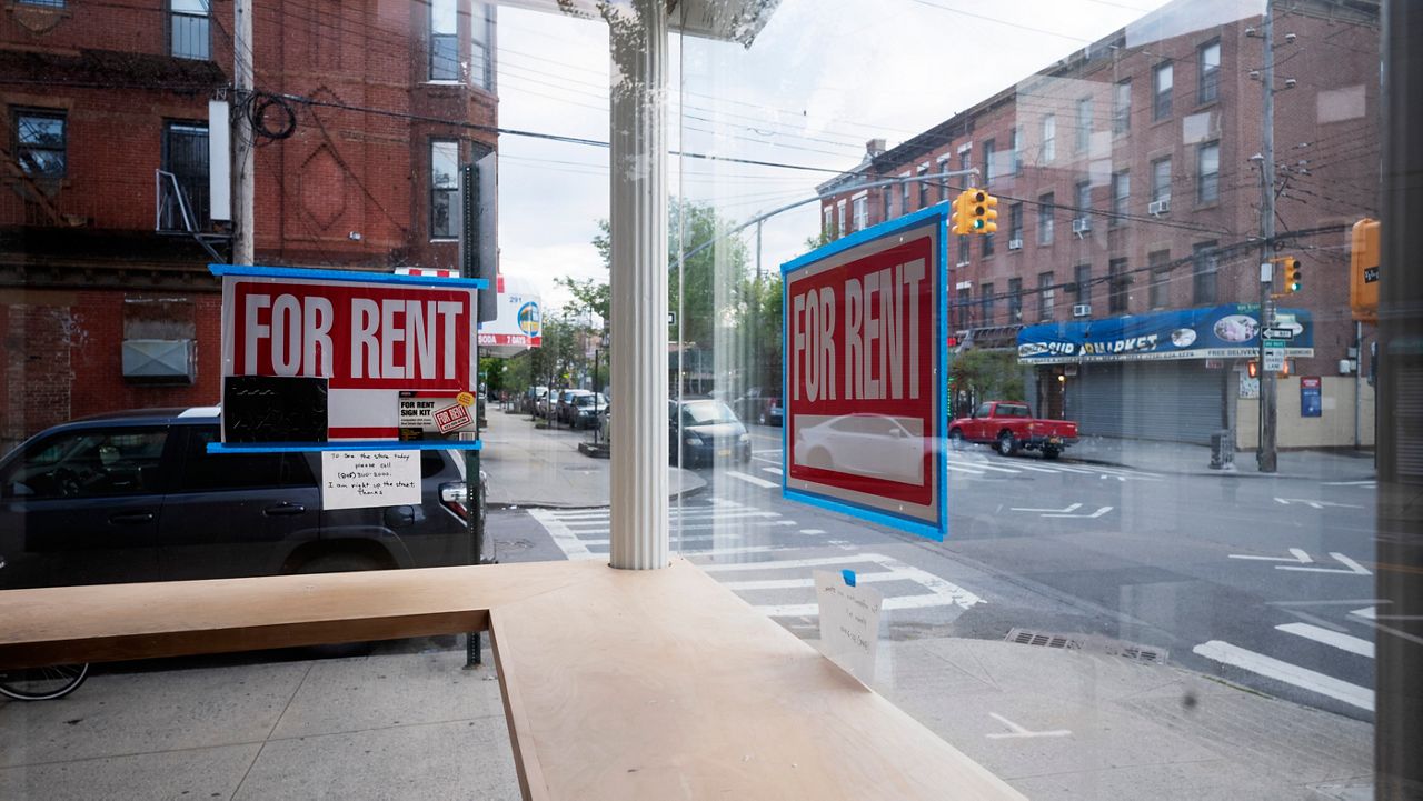 An empty storefront displays a “For Rent” sign in Red Hook, Brooklyn. (AP Photo/Mark Lennihan, File)