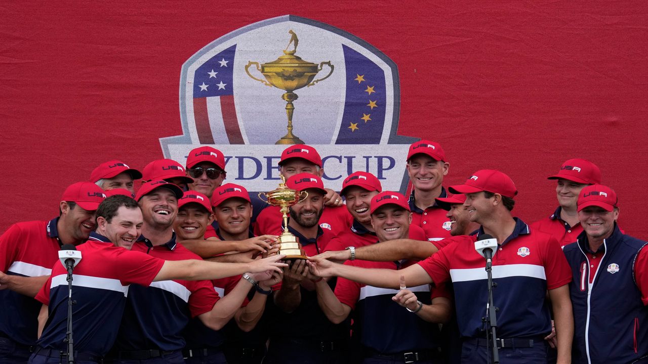 Team USA players pose with the trophy after the Ryder Cup matches at the Whistling Straits Golf Course Sunday, Sept. 26, 2021, in Sheboygan, Wis. (AP Photo/Ashley Landis)