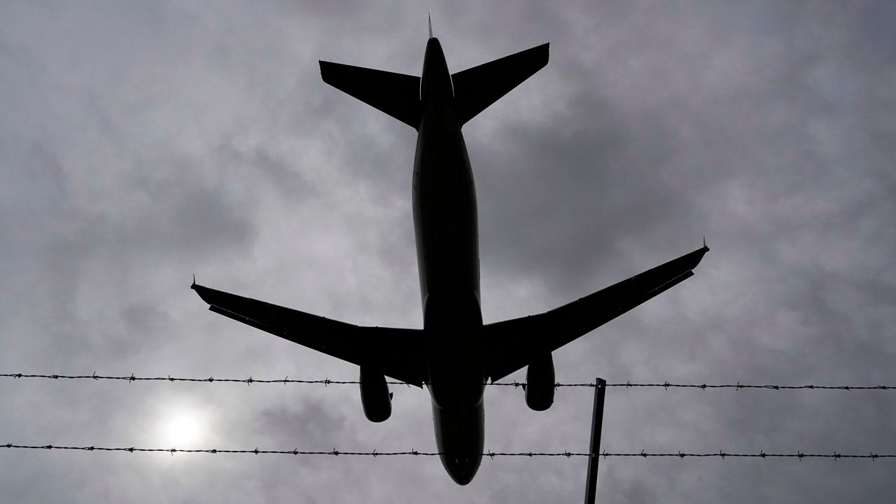 A commercial aircraft appears in this file image. (AP Photo)
