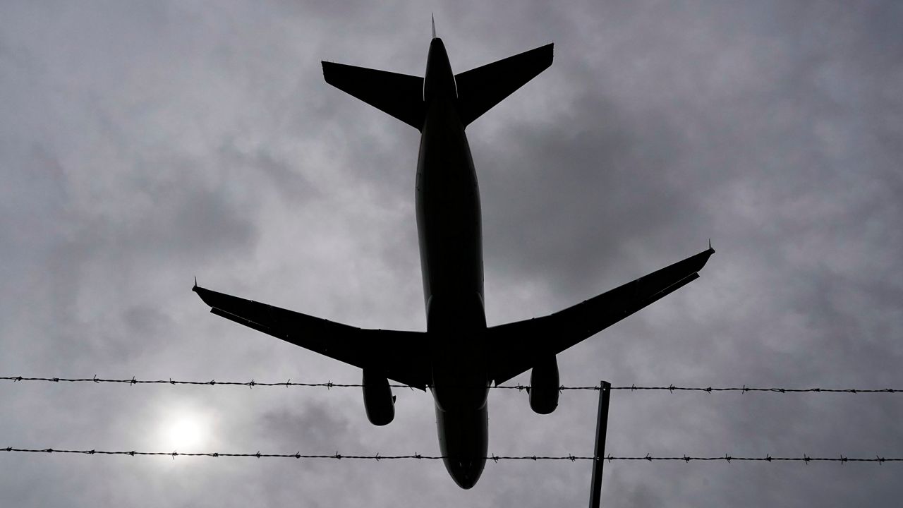 An American Airlines flight lands at General Mitchell International Airport Wednesday, Oct. 13, 2021, in Milwaukee. (AP Photo/Morry Gash)