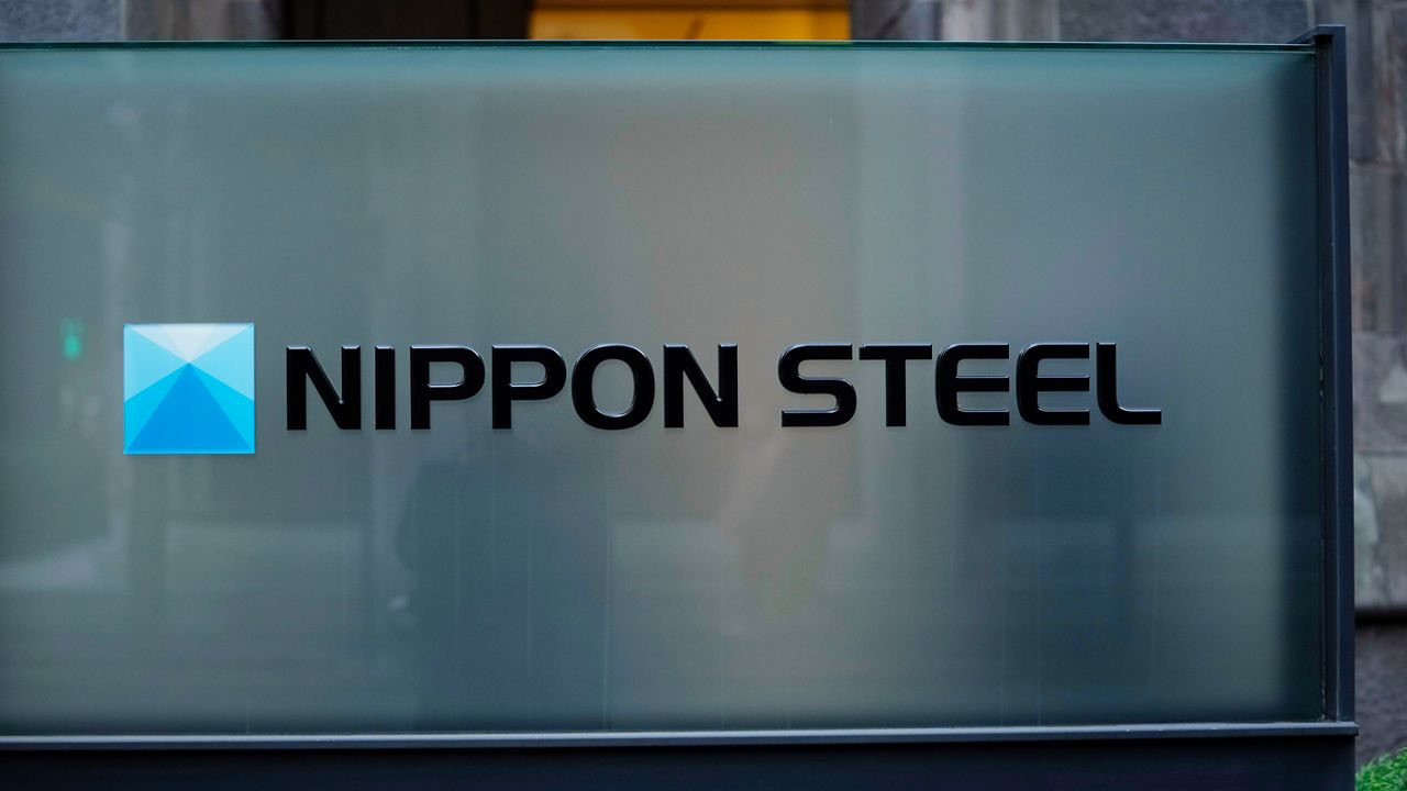 Nippon Steel Corporation's logo is displayed on a sign outside its headquarters in Tokyo, Friday, Nov. 26, 2021.