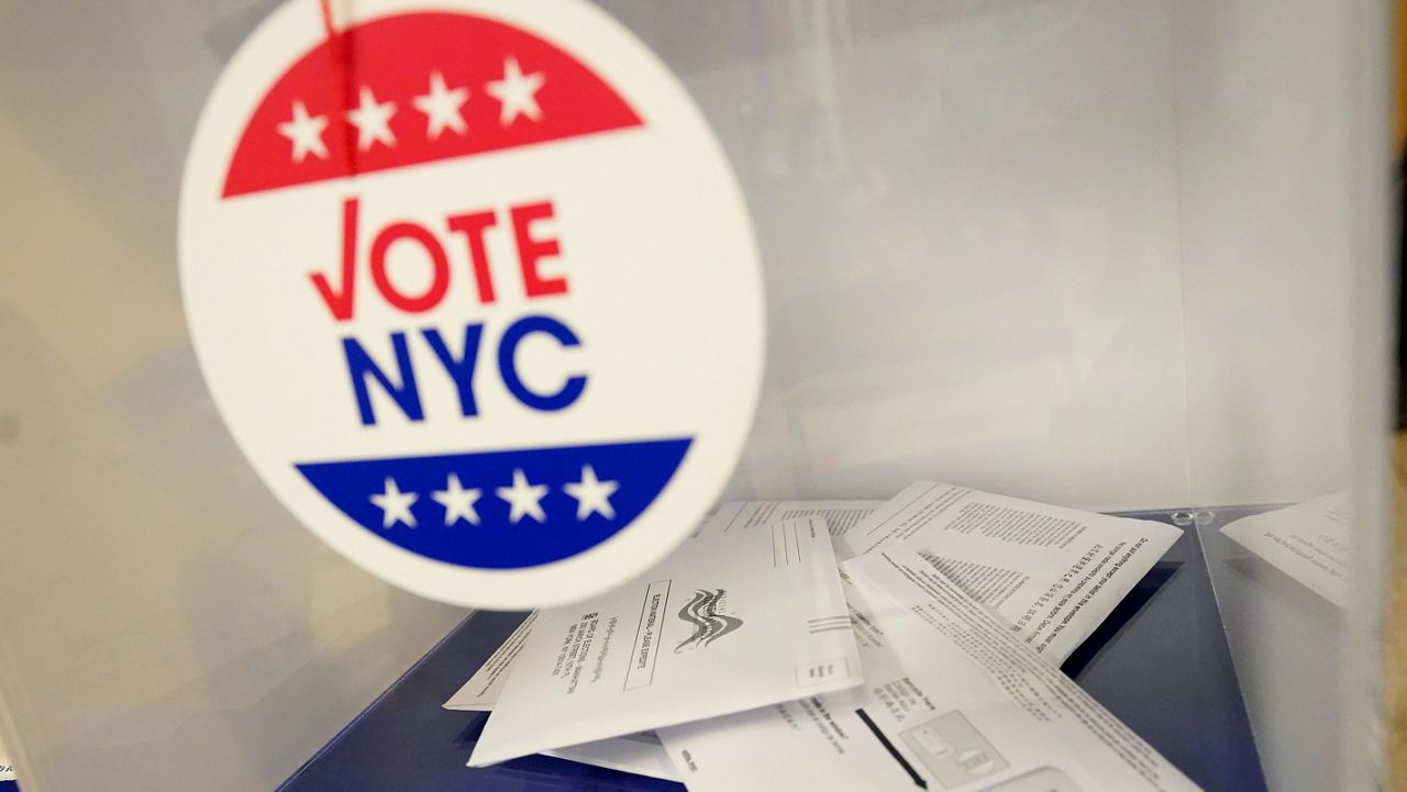 Absentee ballots sit in a ballot box during early voting in the primary election, Monday, June 14, 2021, at the Church of St. Anthony of Padua in the Soho neighborhood of New York. (AP Photo/Mary Altaffer, File)
