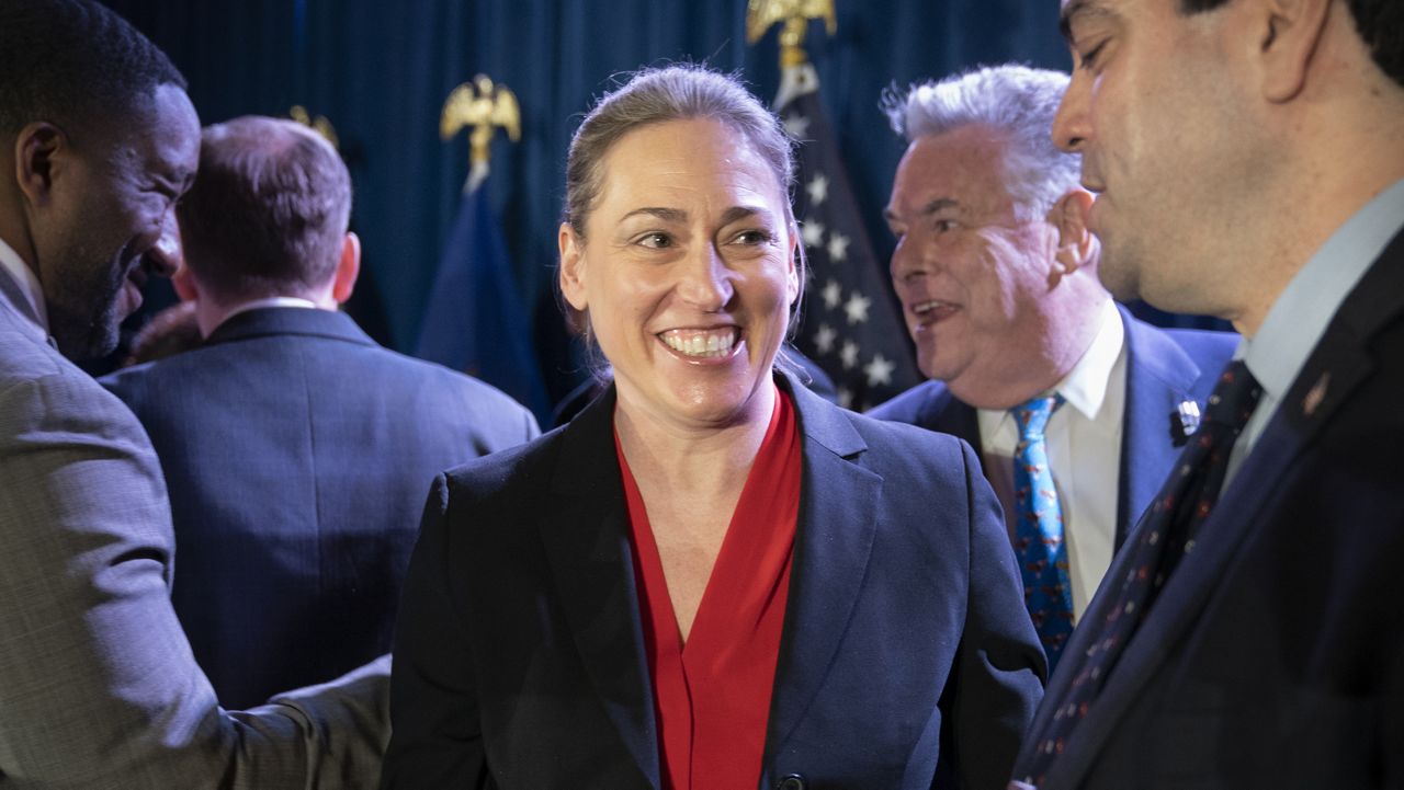 Congressional candidate Alison Esposito, then-lieutenant governor candidates, center, smiles after Lee Zeldin's speech to delegates and assembled party officials at the 2022 NYGOP Convention (AP Photo/John Minchillo)