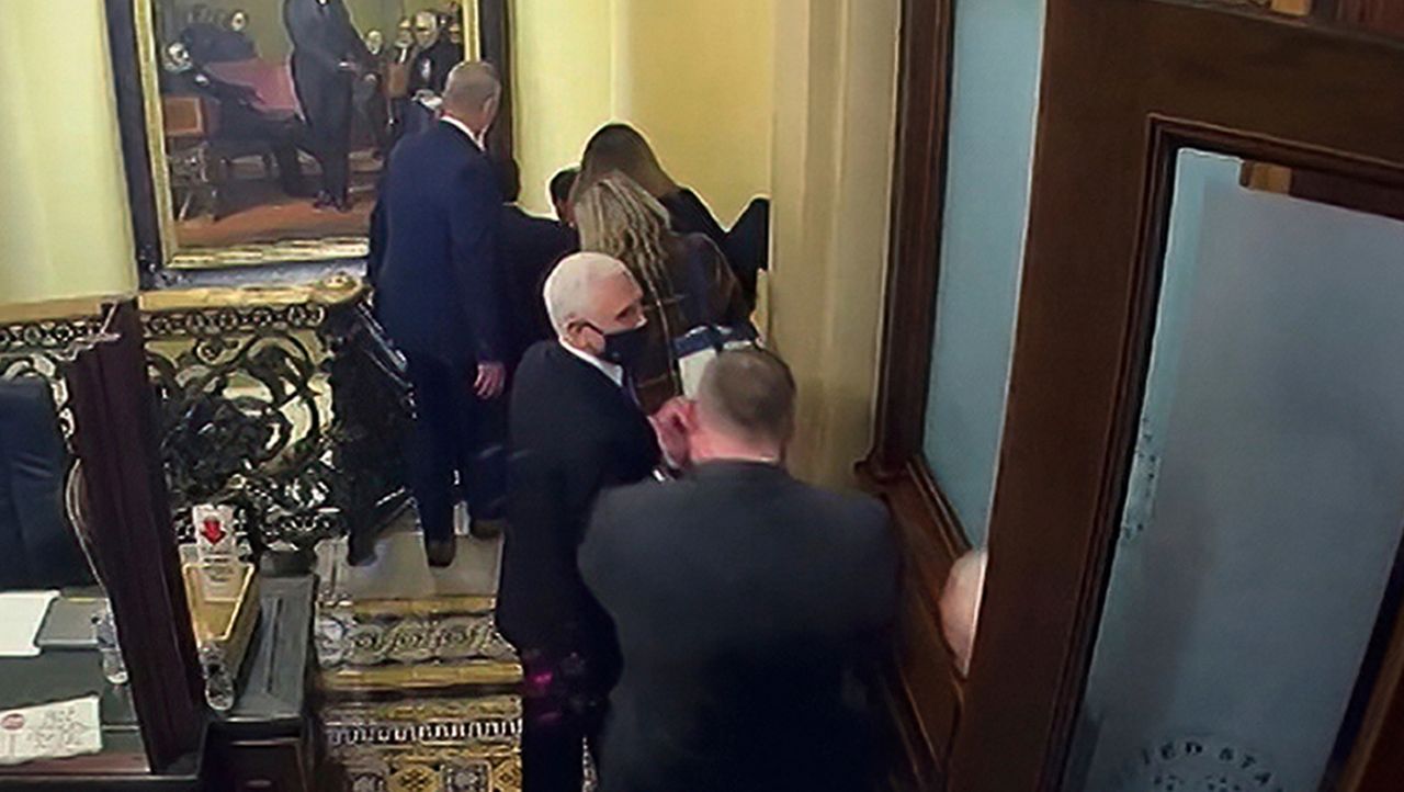 In this image from video, a security video shows Vice President Mike Pence being evacuated from near the Senate chamber as rioters breach the Capitol, on Jan. 6, 2021, at the Capitol in Washington. (Senate Television via AP)