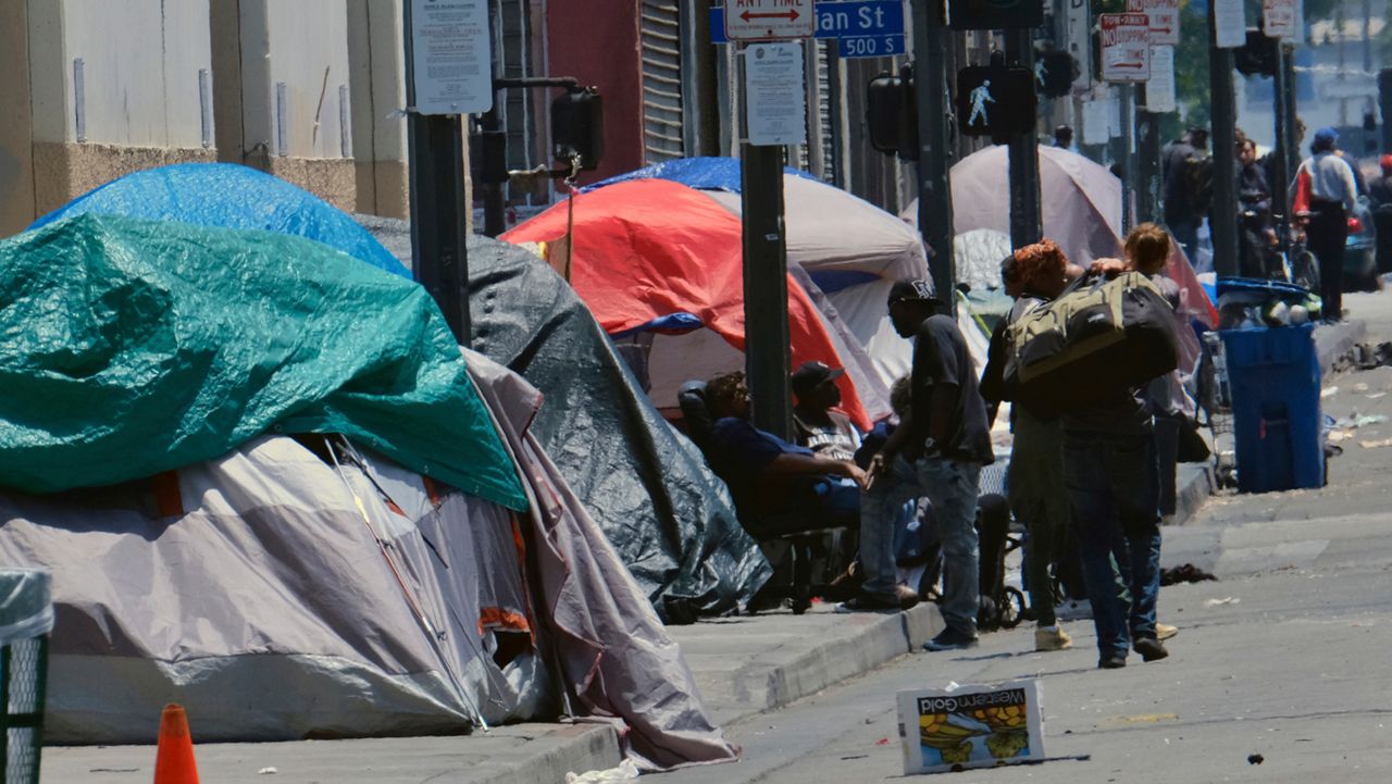 Tents housing homeless line a street down the street from LAPD Central Community Police Station in downtown Los Angeles. (AP Photo/Richard Vogel)