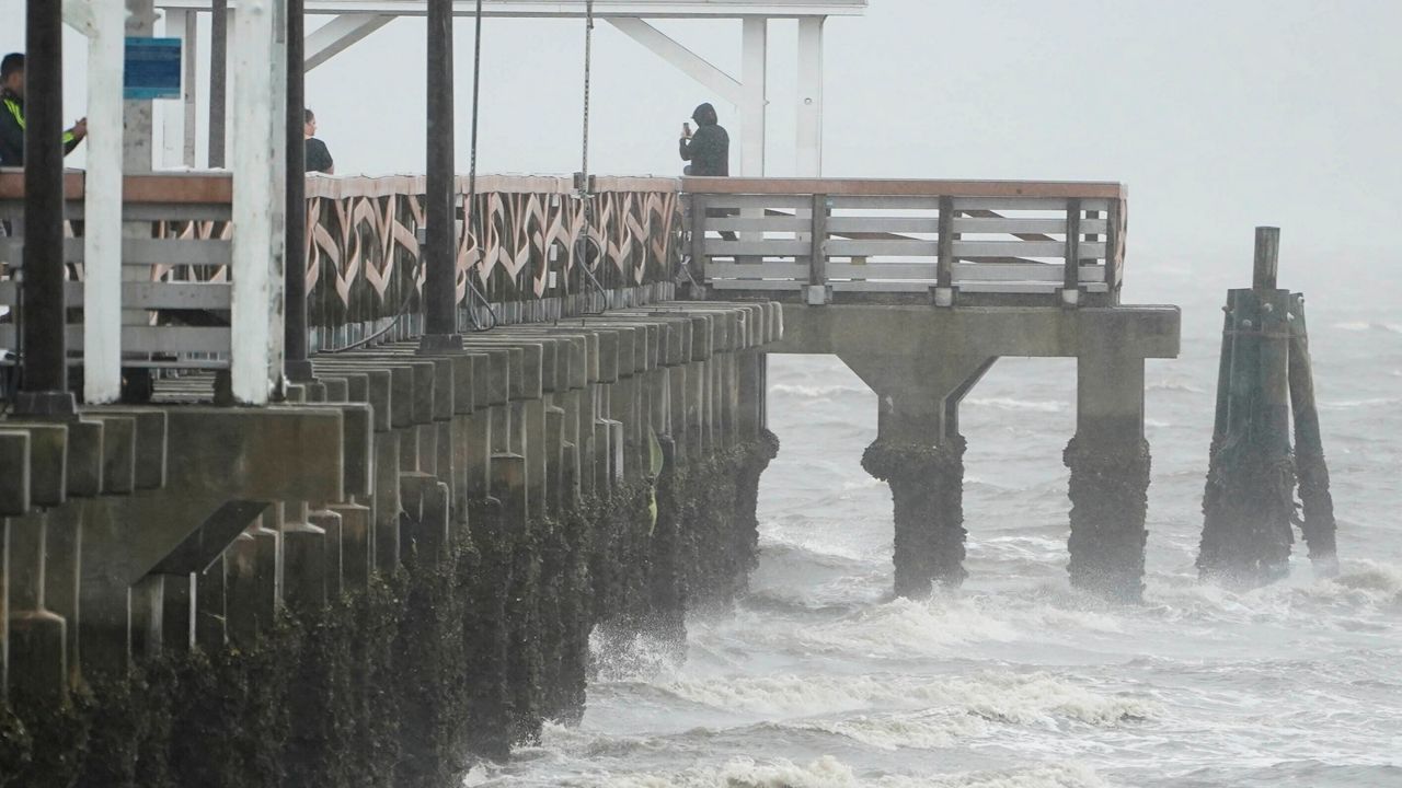 Waves crash along the Ballast Point Pier ahead of Hurricane Ian, Wednesday, Sept. 28, 2022, in Tampa, Fla. The U.S. National Hurricane Center says Ian's most damaging winds have begun hitting Florida's southwest coast as the storm approaches landfall. 