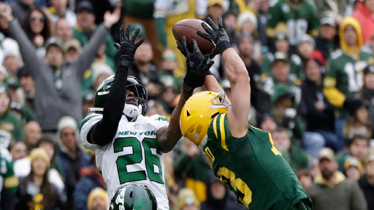 New York Jets cornerback Brandin Echols (26) breaks up a pass intended for Green Bay Packers wide receiver Allen Lazard during the second half of an NFL football game Sunday, Oct. 16, 2022, in Green Bay, Wis. (AP Photo/Matt Ludtke)