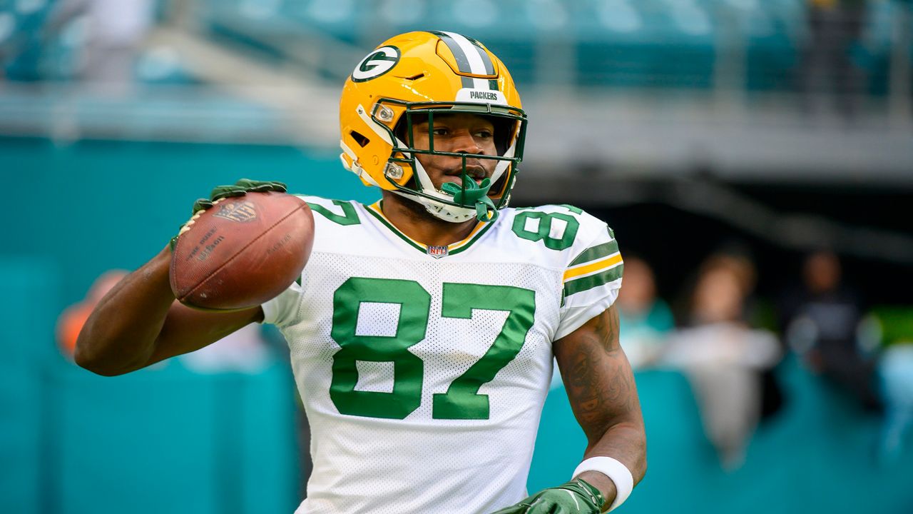 Green Bay Packers wide receiver Romeo Doubs (87) holds a football on the field before an NFL football game against the Miami Dolphins, Sunday, Dec. 25, 2022, in Miami Gardens, Fla. (AP Photo/Doug Murray)