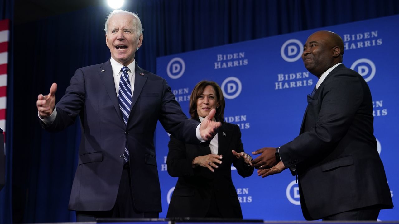 President Joe Biden and Vice President Kamala Harris stand on stage at the Democratic National Committee winter meeting, Friday, Feb. 3, 2023, in Philadelphia, with DNC chair Jaime Harrson, right. (AP Photo/Patrick Semansky)