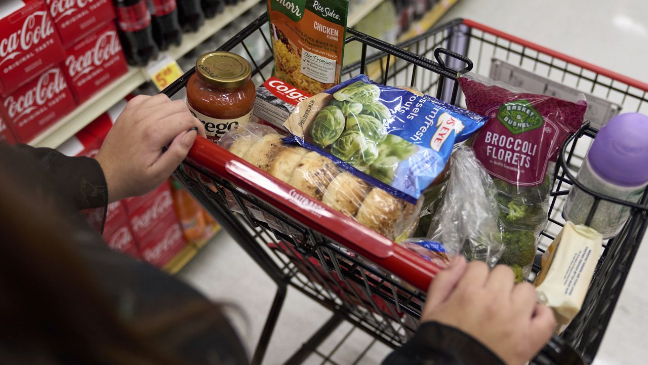 Jaqueline Benitez, who depends on California's SNAP benefits to help pay for food, shops for groceries at a supermarket in Bellflower, Calif., on Monday, Feb. 13, 2023. (AP Photo/Allison Dinner)