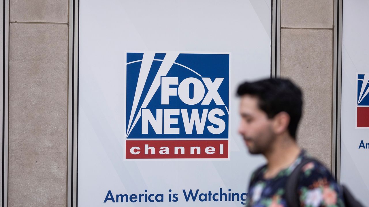 A person walks past the Fox News Headquarters in New York on April 12, 2023.