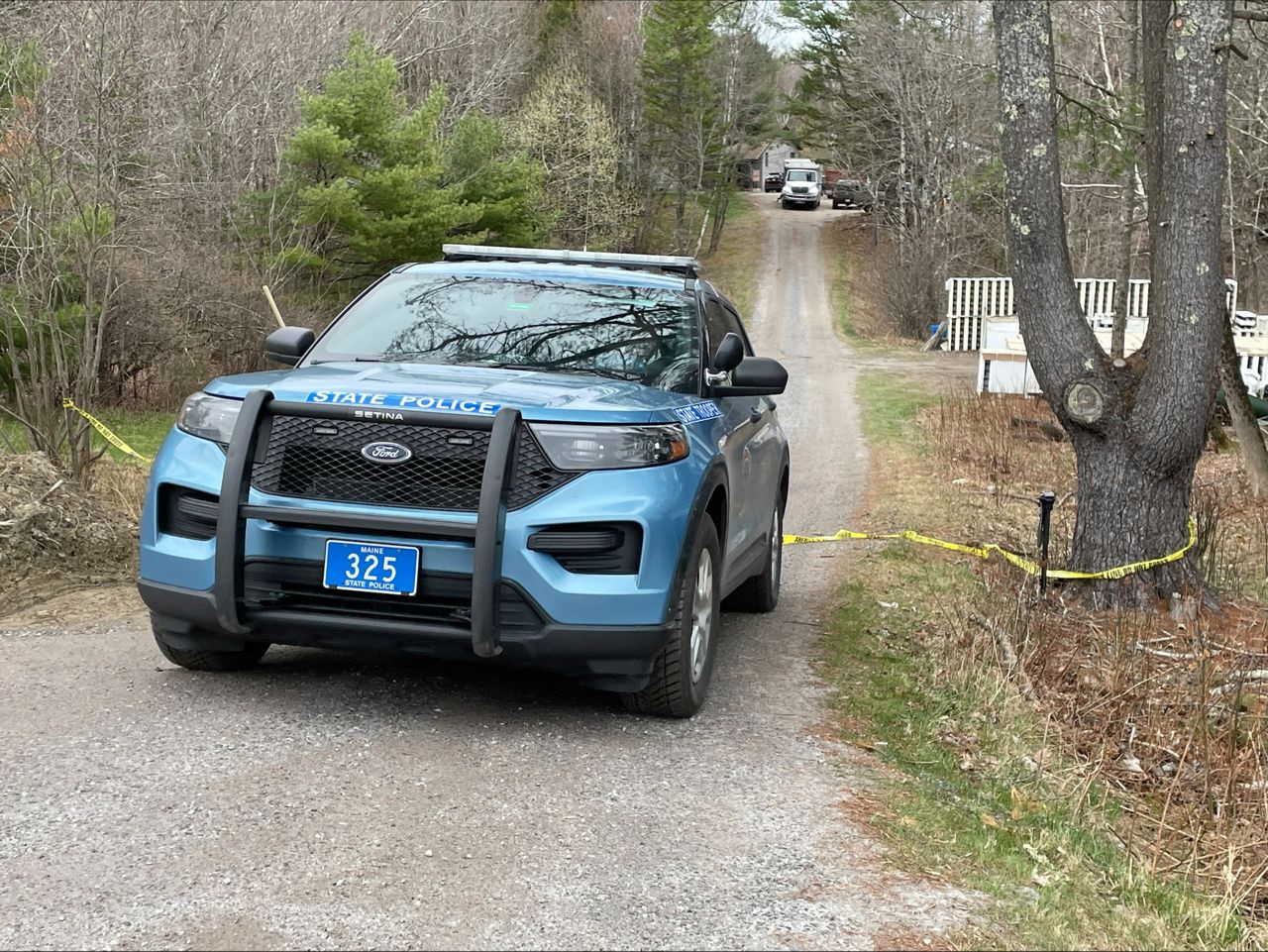 A Maine State police cruiser drives out of a crime scene in Bowdoin, Maine, Wednesday, April 19. A Maine man who police say killed four people in a home and then shot three others randomly on a busy highway had been released days earlier from prison, a state official said Wednesday. (AP Photo/Rodrique Ngowi)