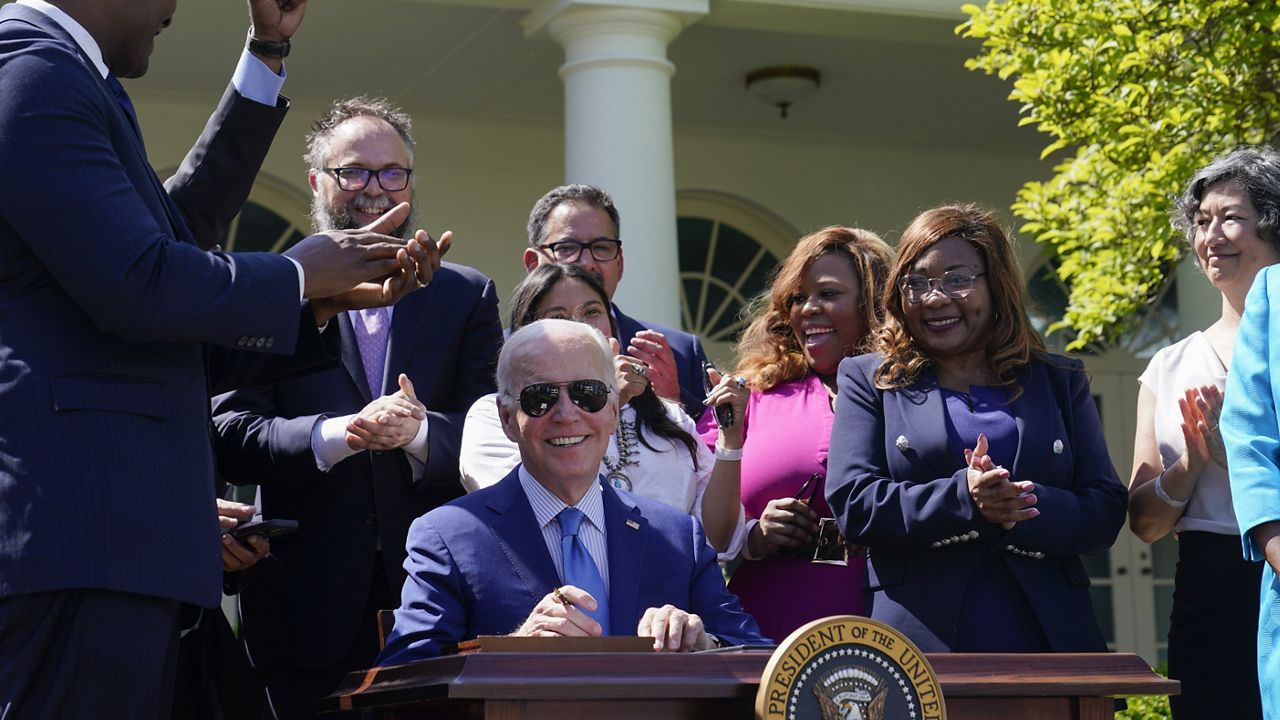 President Joe Biden smiles after signing an executive order that would create the White House Office of Environmental Justice after speaking from the Rose Garden of the White House in Washington, Friday, April 21, 2023. (AP Photo/Susan Walsh)