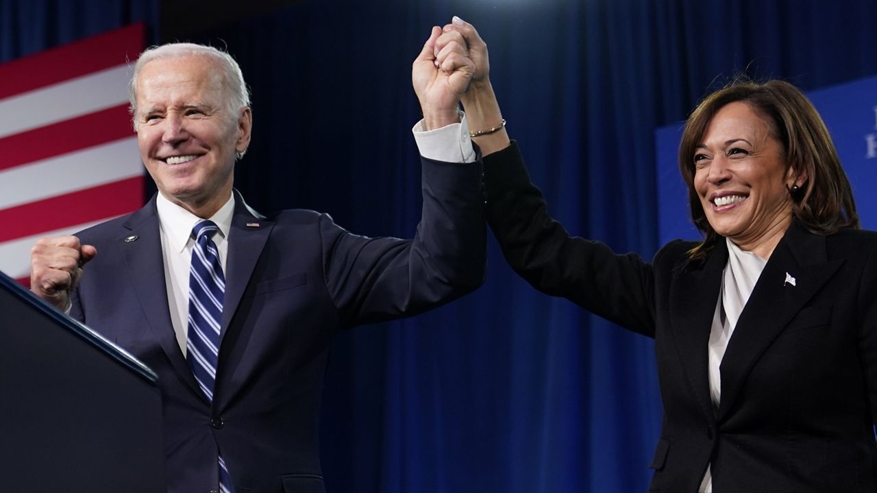 President Joe Biden and Vice President Kamala Harris stand on stage at the Democratic National Committee winter meeting, Feb. 3, 2023, in Philadelphia. (AP Photo/Patrick Semansky)