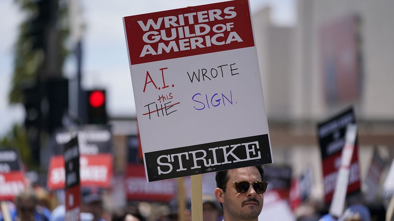 Members of the The Writers Guild of America picket outside Fox Studios on Tuesday, May 2, 2023, in Los Angeles. (AP Photo/Ashley Landis)