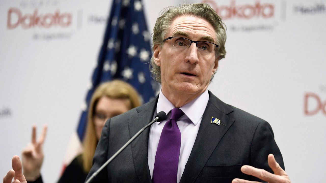 North Dakota Gov. Doug Burgum speaks at the state Capitol on April 10, 2020, in Bismarck, N.D. Burgum has signed a bill into law that allows public school teachers and state government employees to ignore the pronouns their transgender students and colleagues use, the governor's office announced Monday, May 8, 2023 (Mike McCleary/The Bismarck Tribune via AP)