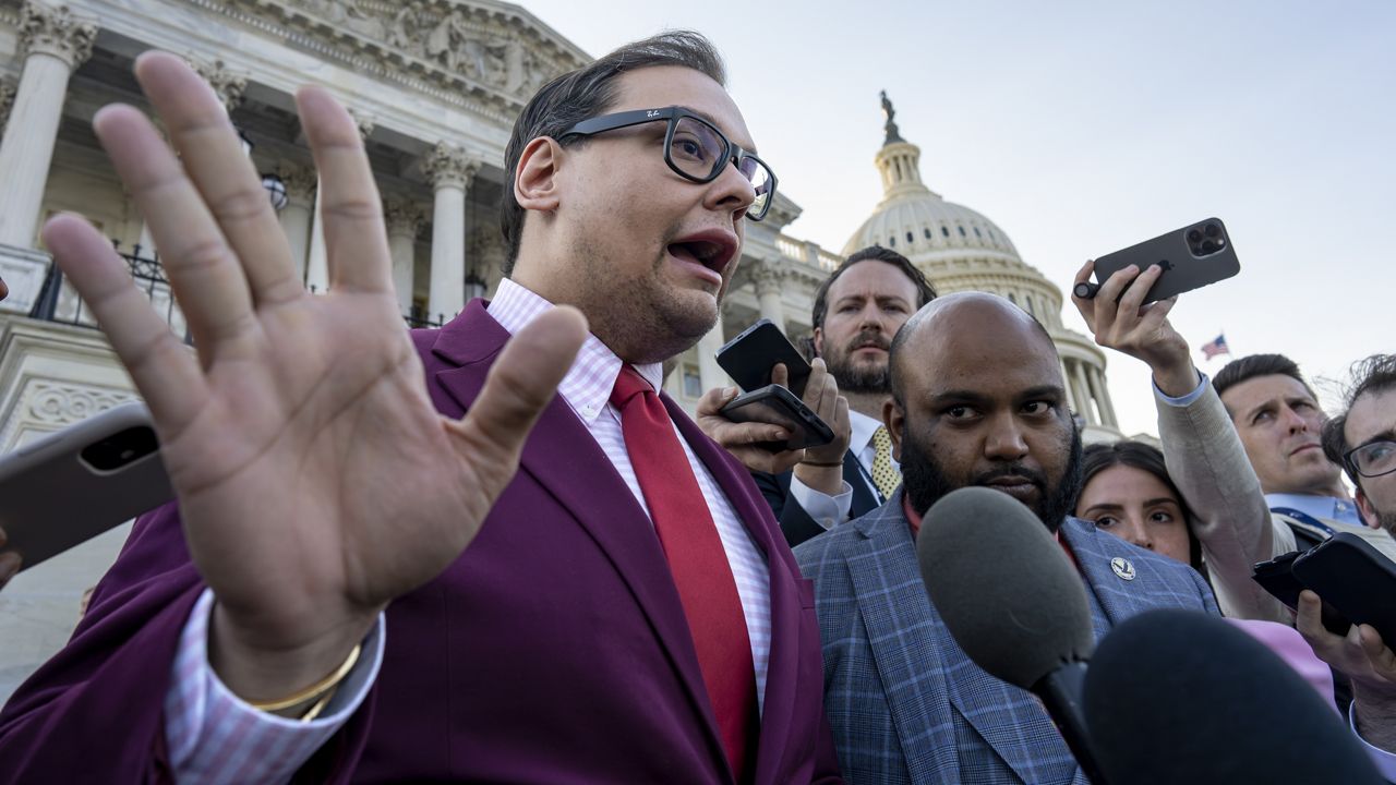 Rep. George Santos, R-N.Y., speaks to reporters outside after an effort to expel him from the House, at the Capitol in Washington, Wednesday, May 17, 2023. (AP Photo/J. Scott Applewhite)