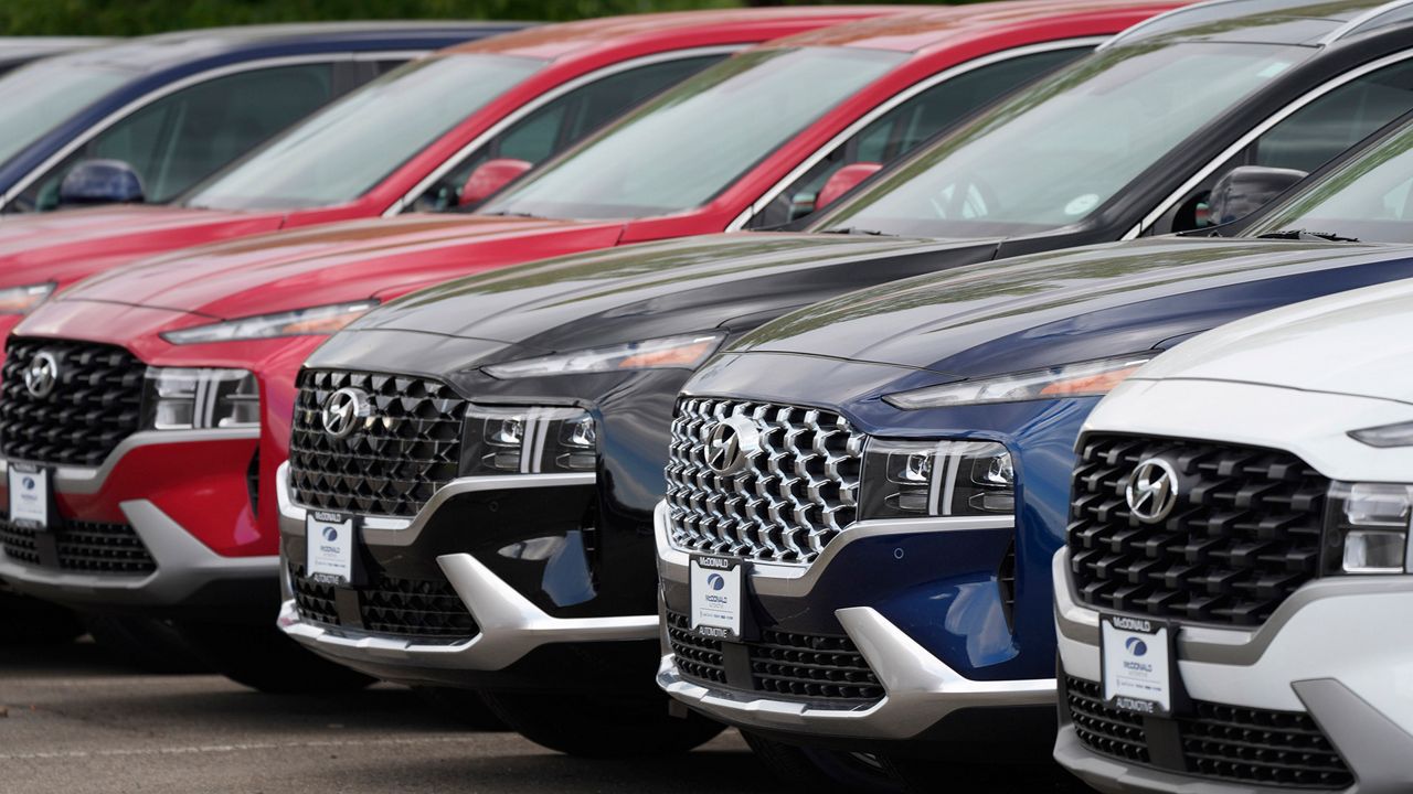 A line of 2022 Santa Fe SUV's sit outside a Hyundai dealership Sunday, Sept. 12, 2021, in Littleton, Colo. (AP Photo/David Zalubowski, File)