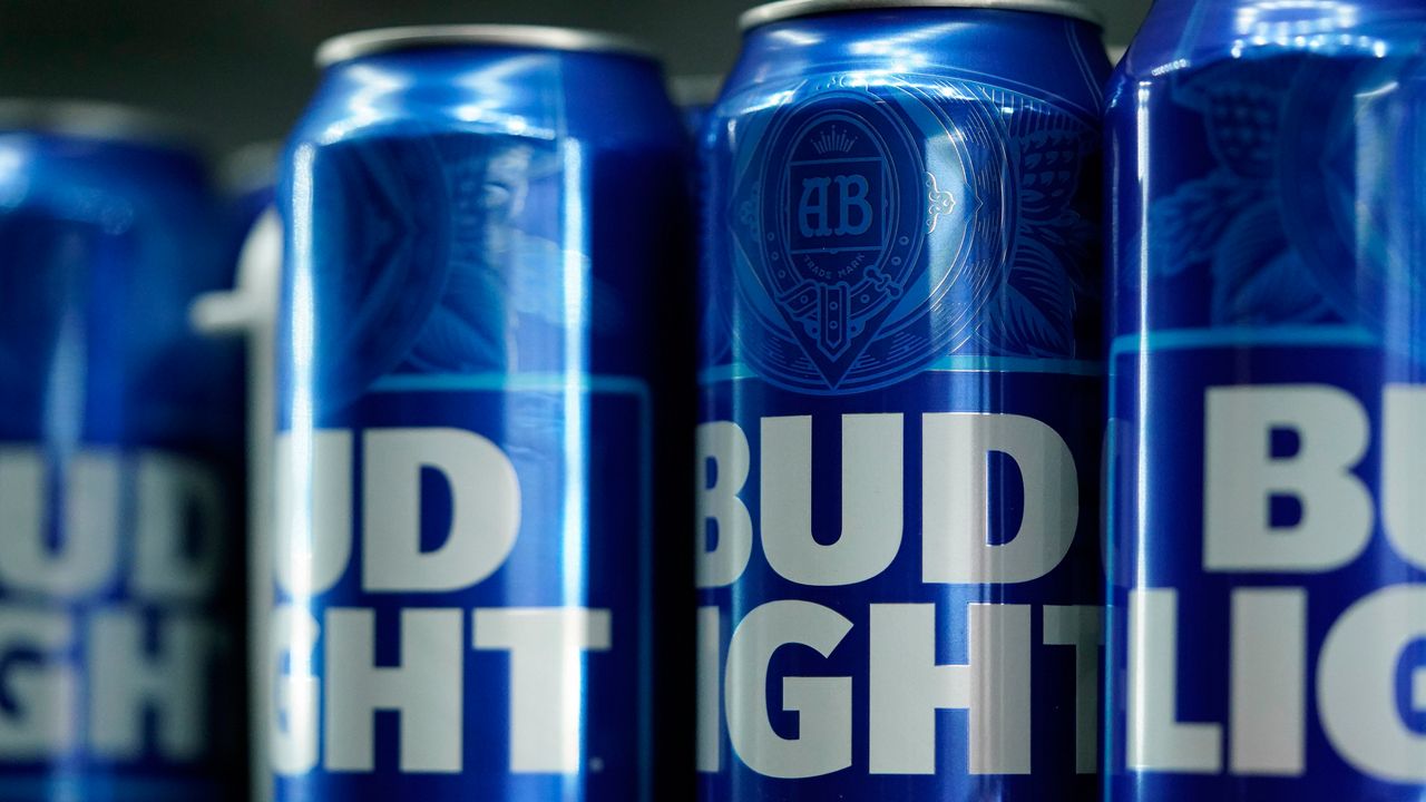 FILE - Cans of Bud Light beer are seen before a baseball game between the Philadelphia Phillies and the Seattle Mariners on April 25, 2023, in Philadelphia. The country's largest advocacy group for LGBTQ+ rights has suspended its benchmark equality and inclusion rating for Anheuser-Busch, citing the beer company's handling of hate-filled and transphobic backlash received after its partnership with transgender influencer Dylan Mulvaney in April. (AP Photo/Matt Slocum, File)