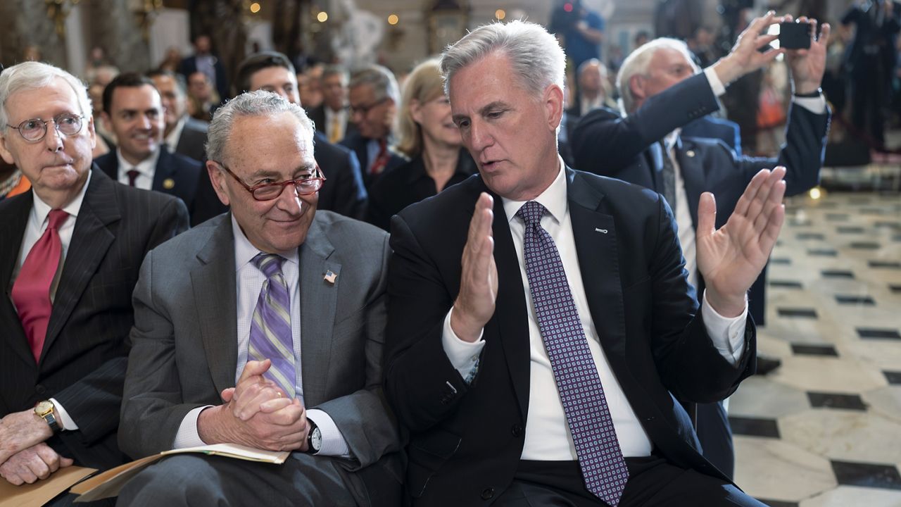 FILE - From left, Senate Minority Leader Mitch McConnell, R-Ky., Senate Majority Leader Chuck Schumer, D-N.Y., and Speaker of the House Kevin McCarthy, R-Calif., sit together during a ceremony at the Capitol in Washington, Wednesday, May 17, 2023. (AP Photo/J. Scott Applewhite, File) 