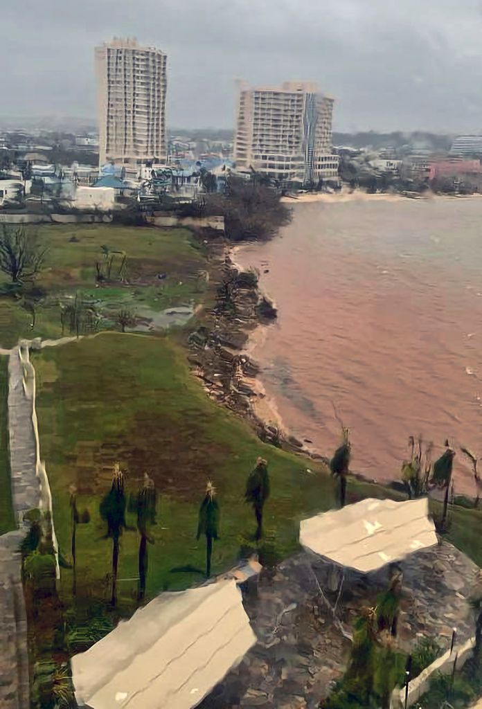 In this photo provided by the U.S. Coast Guard, Hagatna Bay in Hagatna, Guam, is shown Thursday, May 25, 2023, after Typhoon Mawar passed over the island. The powerful typhoon smashed the U.S. territory of Guam and continued lashing the Pacific island with high winds and heavy rain Thursday, knocking down trees, walls and power lines and creating a powerful storm surge that threatened to wash out low-lying areas. (Chief Warrant Officer Manny Pangalinan/U.S. Coast Guard via AP)