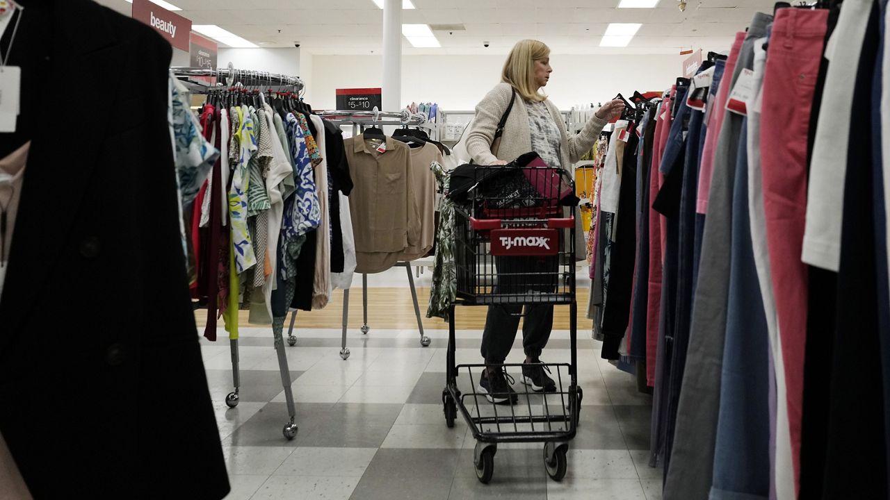 A customer checks prices while shopping Monday at a retail store in Vernon Hills, Ill. (AP Photo/Nam Y. Huh)