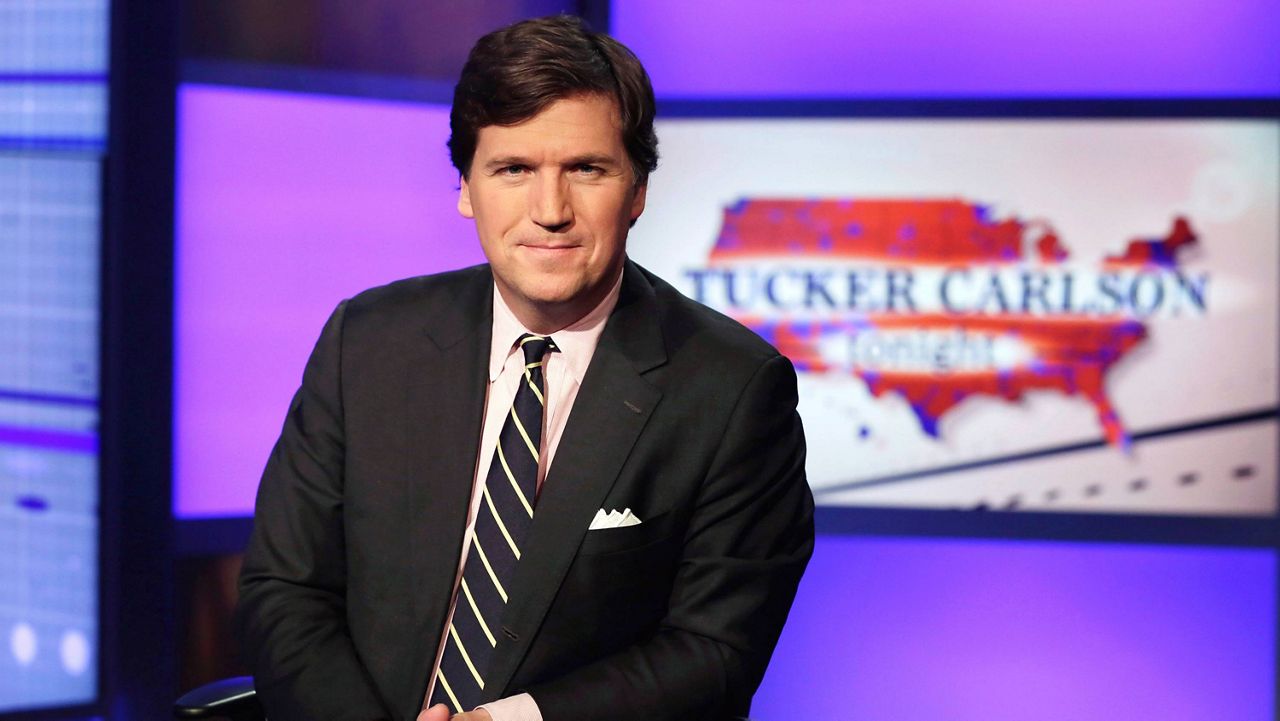 Tucker Carlson, host of "Tucker Carlson Tonight," poses for photos in a Fox News Channel studio on March 2, 2017, in New York. (AP Photo/Richard Drew)