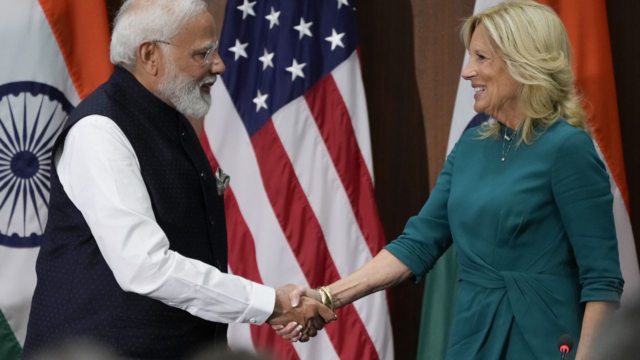 First lady Jill Biden and India's Prime Minister Narendra Modi shake hands 