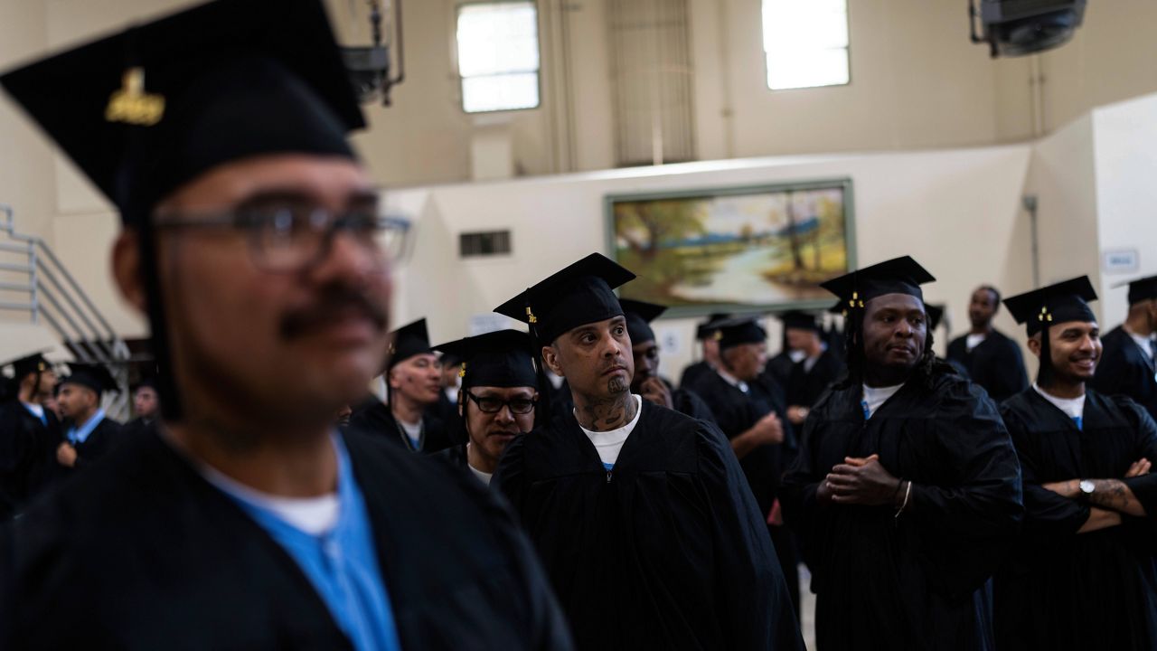 Incarcerated graduates, who finished various educational and vocational programs in prison, wait for the start of their graduation ceremony at Folsom State Prison in Folsom, Calif., Thursday, May 25, 2023. Thousands of prisoners throughout the United States get their college degrees behind bars, most of them paid for by the federal Pell Grant program, which offers the neediest undergraduates tuition aid that they don’t have to repay. That program is about to expand exponentially next month, giving about 30,000 more students behind bars some $130 million in financial aid per year. (AP Photo/Jae C. Hong)