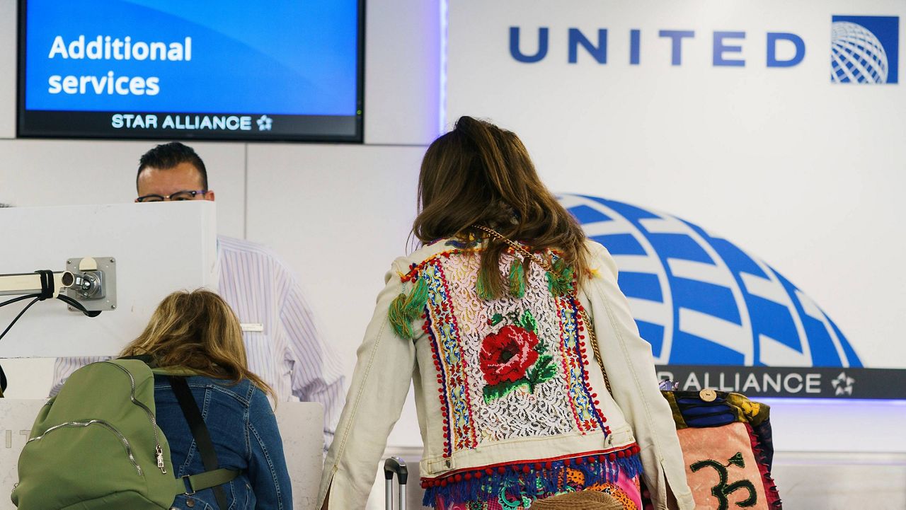 Travelers check-in at the United Airlines terminal at Los Angeles International Airport, Wednesday June 28, 2023, in Los Angeles. Travelers waited out widespread delays at U.S. airports on Tuesday, an ominous sign heading into the long July 4 holiday weekend, which is shaping up as the biggest test yet for airlines that are struggling to keep up with surging numbers of passengers. (AP Photo/Damian Dovarganes)