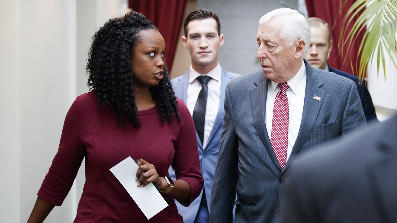 Shuwanza Goff, left, speaks with House Majority Leader Steny Hoyer of Md., as they walk on Capitol Hill in Washington, Jan. 4, 2019. (AP Photo/Carolyn Kaster)