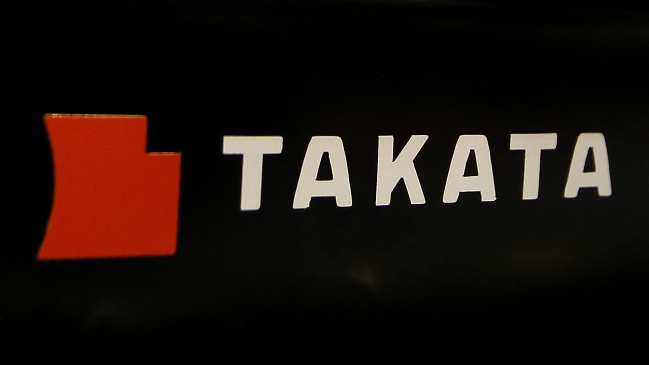 The logo of Takata Corp. is displayed at an auto supply shop in Tokyo, July 6, 2016. (AP Photo/Shizuo Kambayashi)