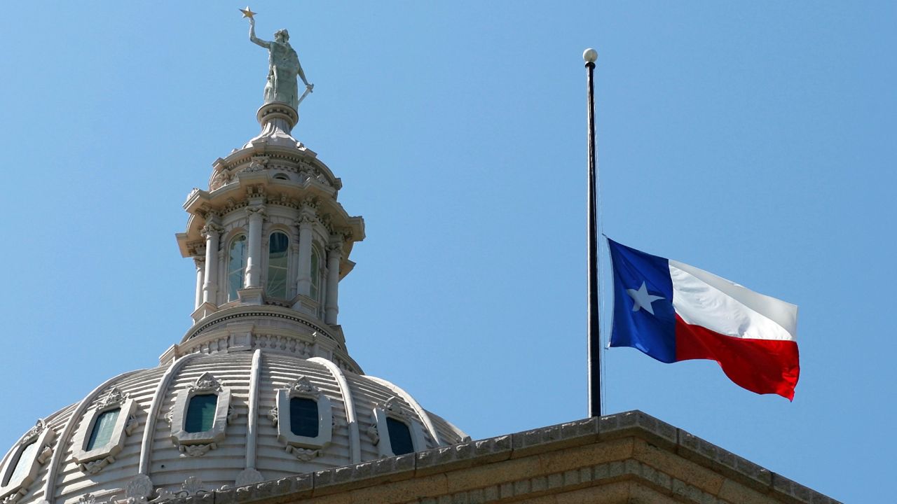 The Texas flag flies at half-staff on the Capitol, Sept. 14, 2006, in Austin, Texas. (AP Photo/Harry Cabluck)