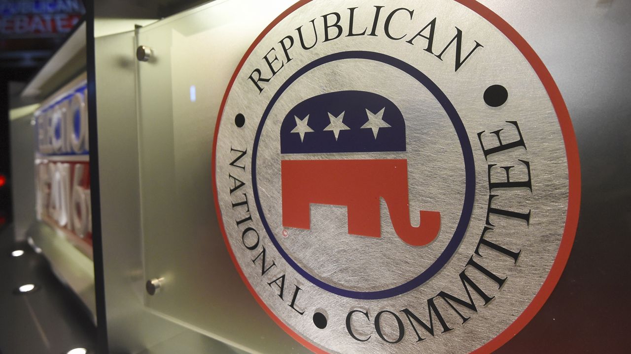 The Republican National Committee logo is shown on the stage as crew members work at the North Charleston Coliseum, Jan. 13, 2016, in North Charleston, S.C. The first 2024 Republican presidential debate is on Wednesday, Aug. 23, 2023, at Fiserv Forum in Milwaukee. (AP Photo/Rainier Ehrhardt, File)