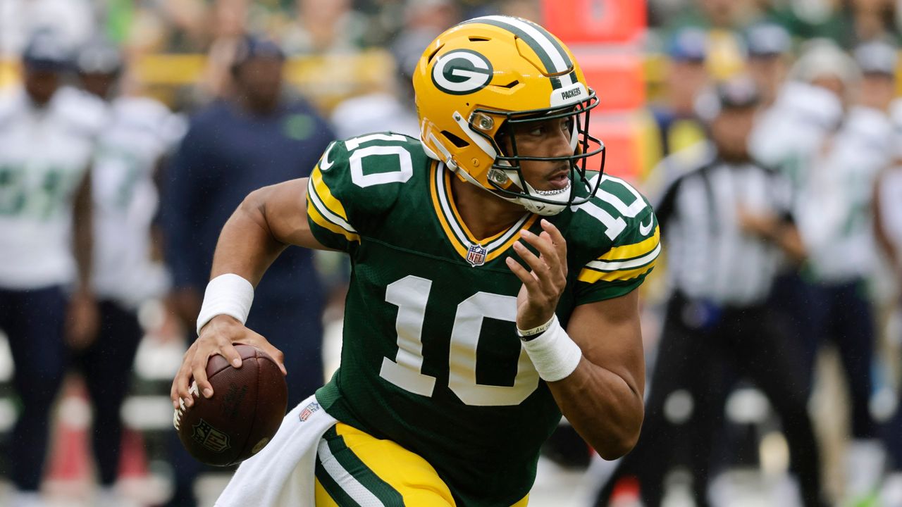 Green Bay Packers quarterback Jordan Love (10) scrambles up field in the first half of a preseason NFL football game against the Seattle Seahawks, Saturday, Aug. 26, 2023, in Green Bay, Wis. 