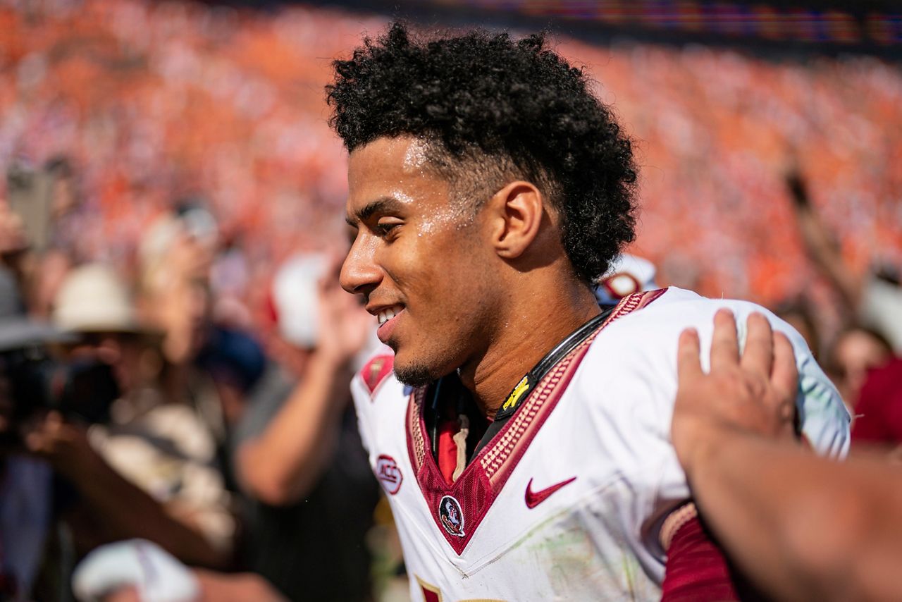 Florida State quarterback Jordan Travis walks off the field after defeating Clemson in an NCAA college football game Saturday, Sept. 23, 2023, in Clemson, S.C. (AP Photo/Jacob Kupferman)