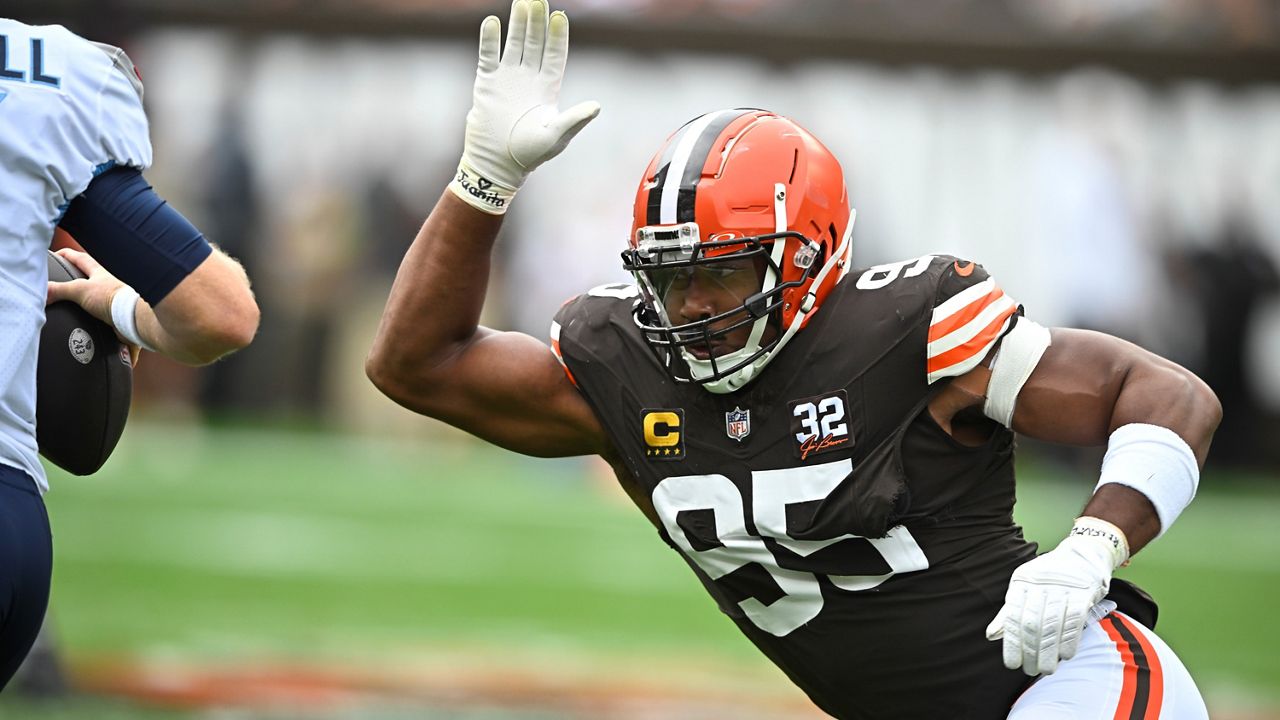 Cleveland Browns defensive end Myles Garrett (95) pressures Tennessee Titans quarterback Ryan Tannehill, left, during the first half of an NFL football game Sunday, Sept. 24, 2023, in Cleveland.