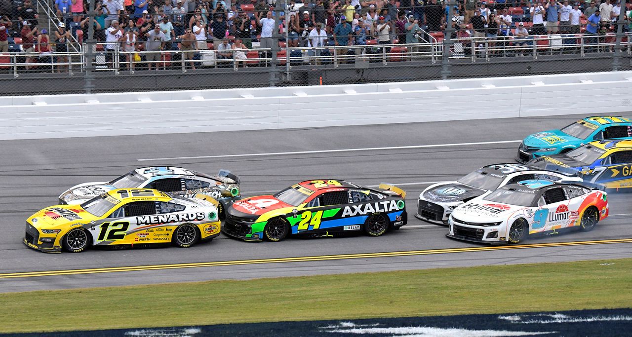 Blaney (12) pulls into the lead on the last lap to win a NASCAR Cup Series auto race at Talladega Superspeedway, Sunday, Oct. 1, 2023, in Talladega, Ala. (AP Photo/Julie Bennett)