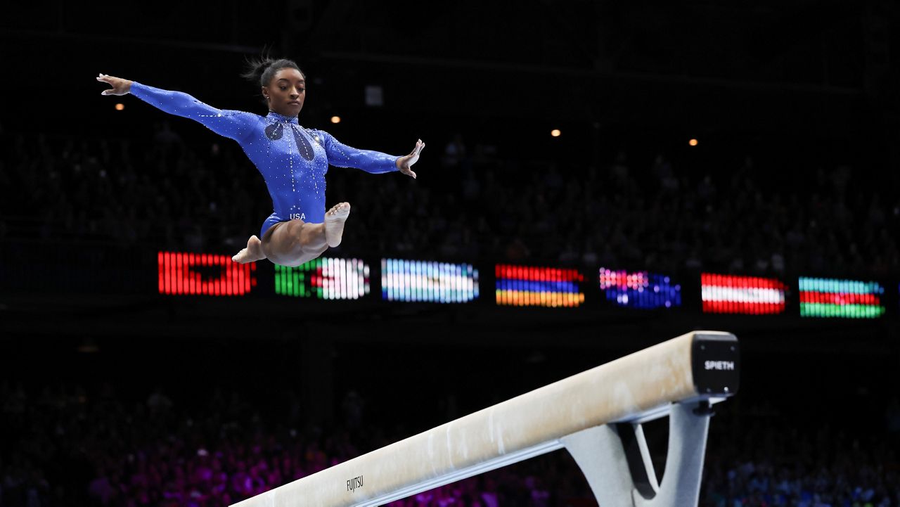 United States' Simone Biles competes on the beam during the women's all-round final at the Artistic Gymnastics World Championships in Antwerp, Belgium, Friday, Oct. 6, 2023. (AP Photo/Geert vanden Wijngaert)