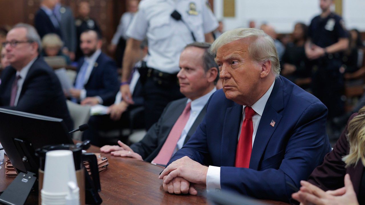 Former President Donald Trump sits in the courtroom with his legal team before the continuation of his civil business fraud trial at New York Supreme Court, Tuesday, Oct. 17, 2023, in New York. (Andrew Kelly/Pool Photo via AP)