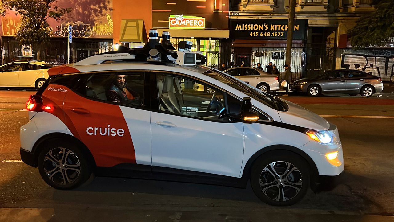 Associated Press reporter Michael Liedtke sits in the back of a Cruise driverless taxi that picked him up in San Francisco's Mission District, Feb. 15, 2023. (AP Photo/Terry Chea)