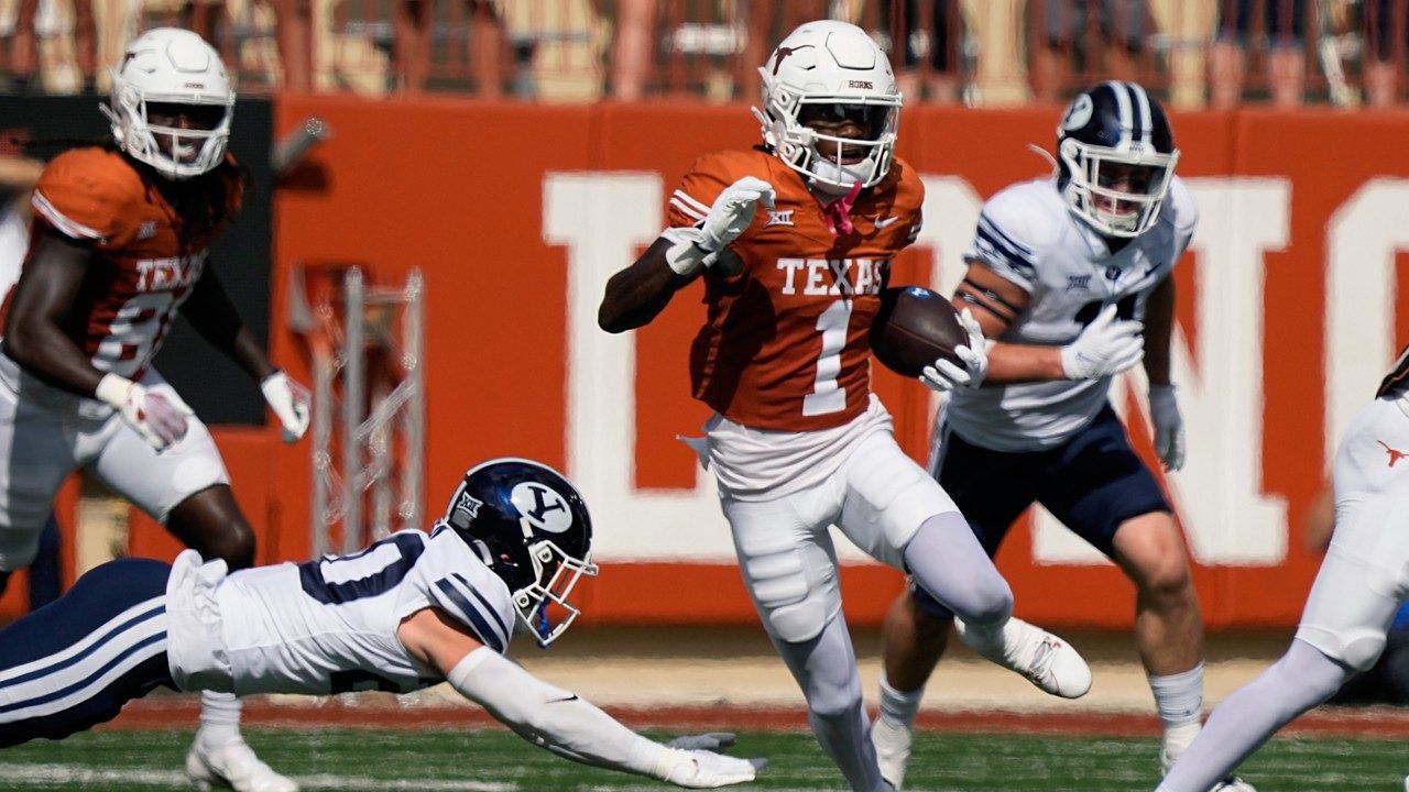 Texas' Xavier Worthy (1) returns a punt for a touchdown against BYU during the first half of an NCAA college football game in Austin, Texas, Saturday, Oct. 28, 2023. (AP Photo/Eric Gay)