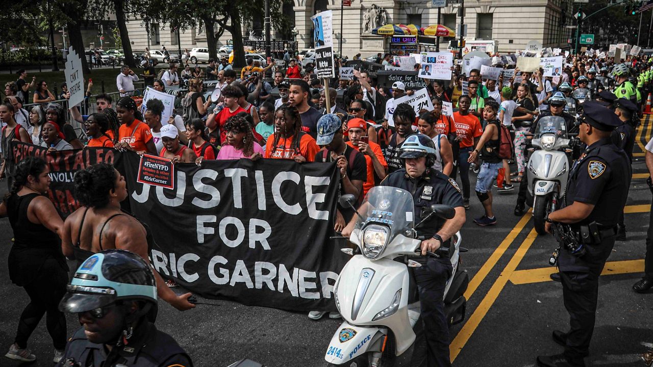 A rally of mostly young people march on July 17, 2019 in New York in protest against the decision by federal prosecutors not to bring civil rights charges against NYPD officer Daniel Pantaleo for the 2014 chokehold death of Eric Garner.