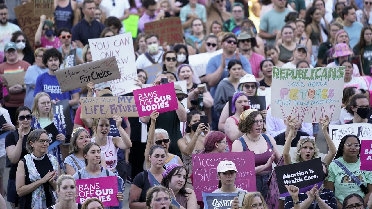 Abortion rights protesters attend a rally outside the state Capitol in Lansing, Mich., June 24, 2022, following the United States Supreme Court's decision to overturn Roe v. Wade. (AP Photo/Paul Sancya, File)