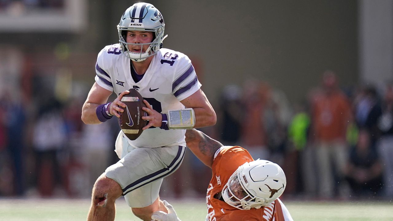 Kansas State quarterback Will Howard (18) is pressured by Texas defensive lineman Byron Murphy II (90) during overtime in an NCAA college football game in Austin, Texas, Saturday, Nov. 4, 2023. Texas coach Steve Sarkisian calls defensive tackles T’Vondre Sweat, an Outland Trophy finalist, and Byron Murphy II the best interior linemen tandem in the country and the anchor for a defense that leads the nation in third down efficiency and red zone defense. (AP Photo/Eric Gay, File)