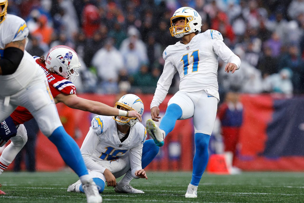 Los Angeles Chargers place kicker Cameron Dicker (11) kicks a field goal during the first half of an NFL football game against the New England Patriots, Sunday, Dec. 3, 2023, in Foxborough, Mass. (AP Photo/Michael Dwyer)