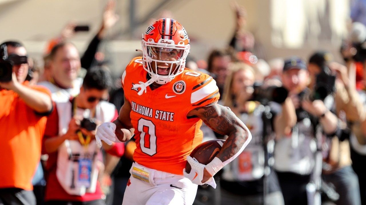 Oklahoma State's Ollie Gordon II (0) celebrates in the end zone after scoring a touchdown during the first half of an NCAA college football game against Kansas in Stillwater, Okla., Saturday, Oct. 14, 2023. Gordon was selected as the Associated Press Big 12 Offensive player of the year. (AP Photo/Mitch Alcala, File)