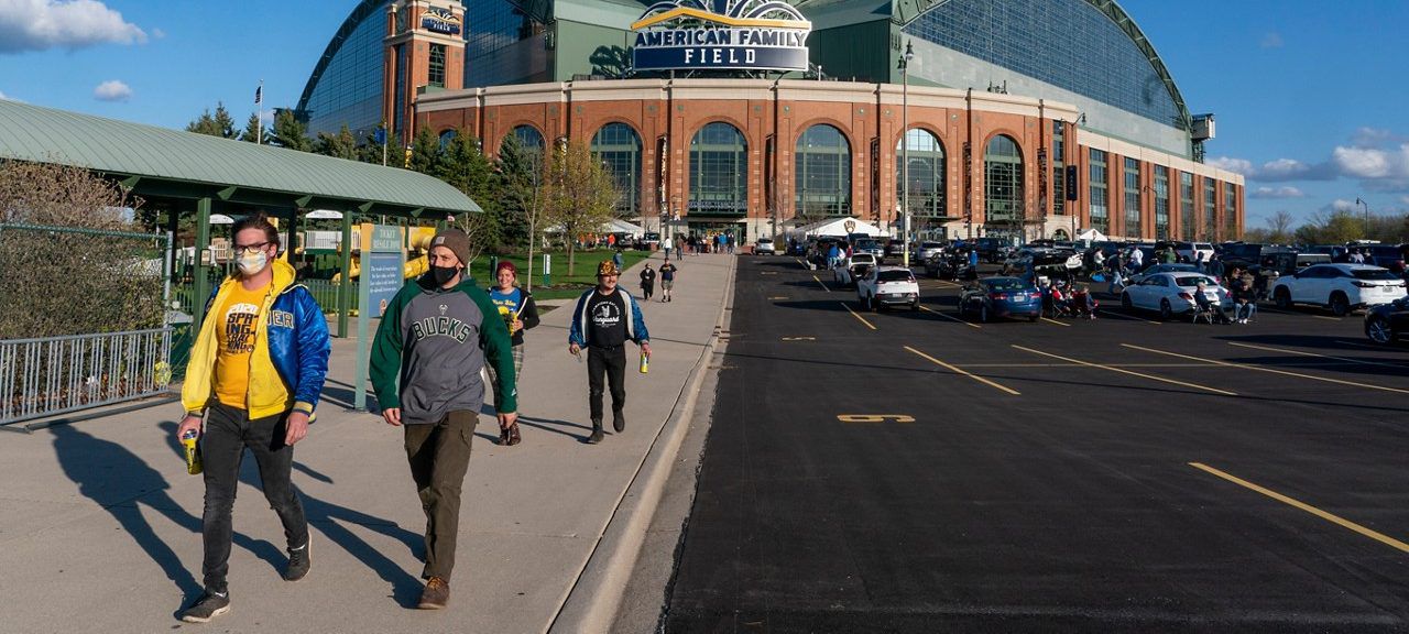 Fans are pictured outside American Family Field before a baseball game on April 12, 2021 in Milwaukee.