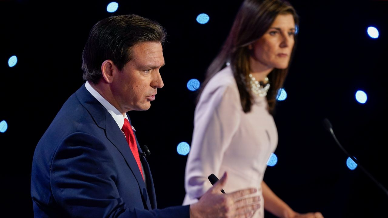 Florida Gov. Ron DeSantis, left, speaking at the CNN Republican presidential debate with former UN Ambassador Nikki Haley, right, at Drake University in Des Moines, Iowa, Wednesday, Jan. 10, 2024. (AP Photo/Andrew Harnik)