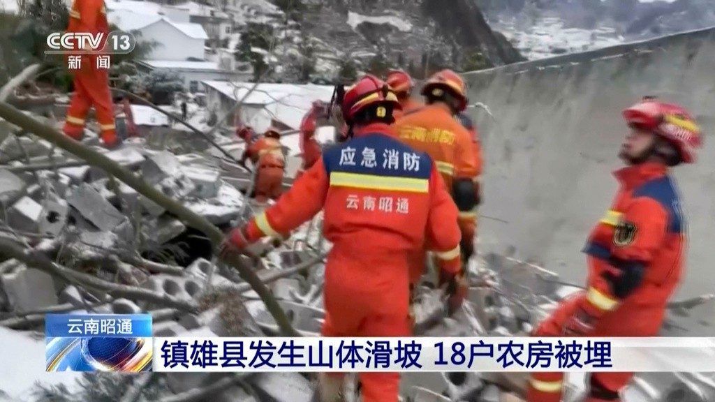 In this image taken from video footage run by China's CCTV, rescue workers search through rubbles in the aftermath of a landslide in liangshui village in southwestern China's Yunnan Province on Monday, Jan. 22, 2024. The landslide in southwestern China's mountainous Yunnan province early Monday buried dozens and forced the evacuation of hundreds. (CCTV via AP)